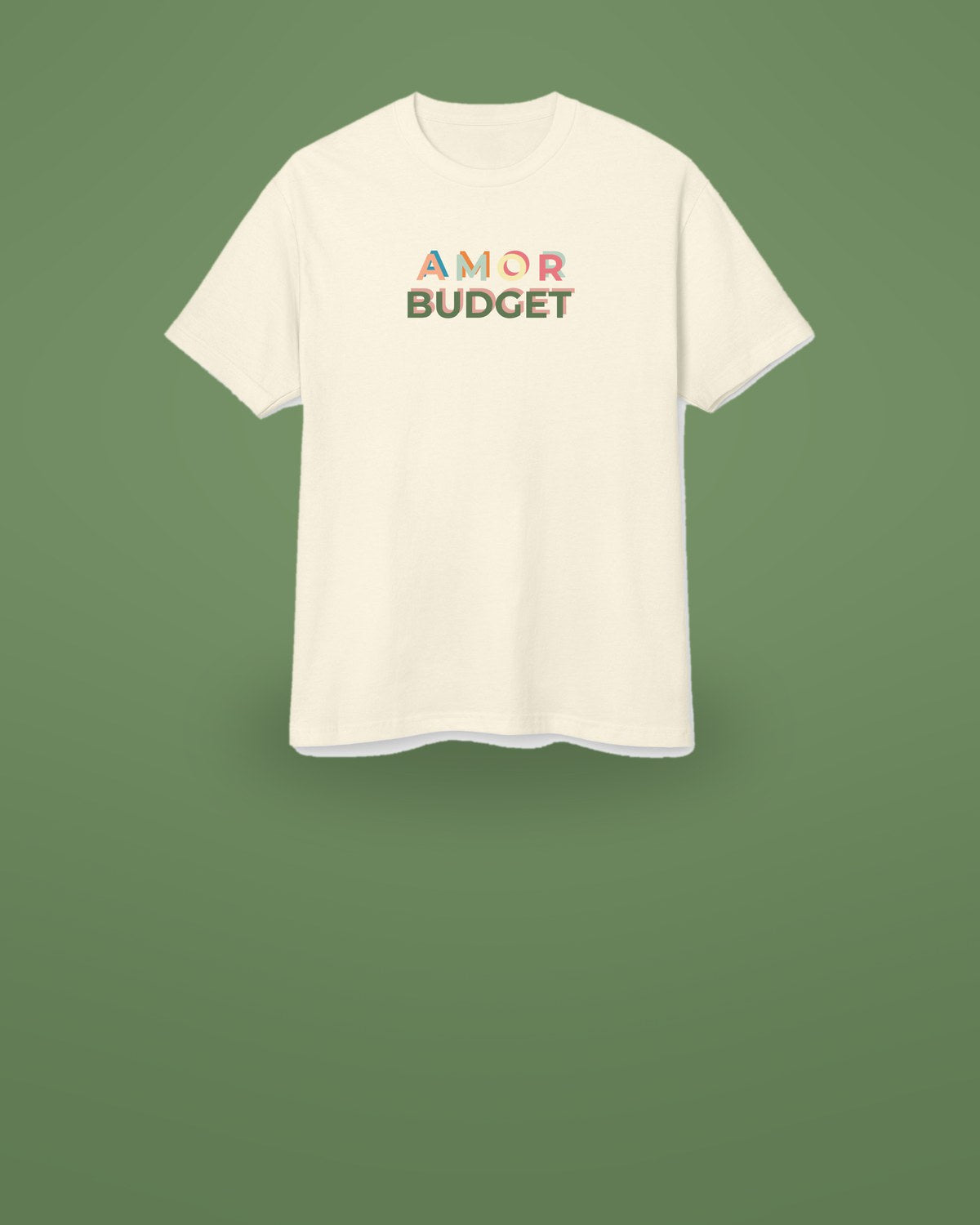 The Amor Budget launch edition tee in faded cream, floating on a sage green field.