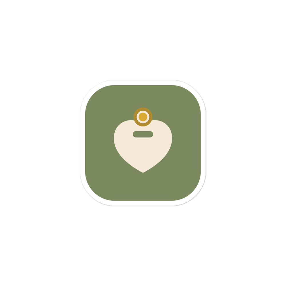 Amor Budget app icon sticker, 3 by 3 inches: a rounded olive green square holding a cream heart with a gold ring above it and an olive dash across its centre.