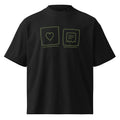 Front of the Amor Budget Heart & Receipt oversized tee in black, printed at the chest with two olive outlined squares, one holding a heart and one holding a receipt with a torn lower edge.